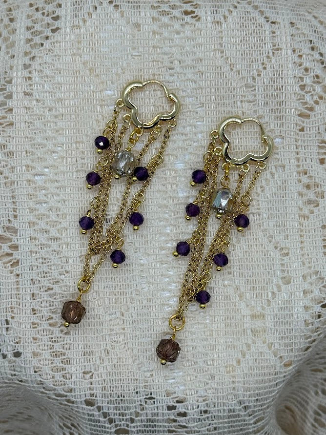 Close-up view of the Amethyst Baroque Earrings, showcasing a central amethyst gemstone surrounded by intricate beadwork in a baroque-inspired design.