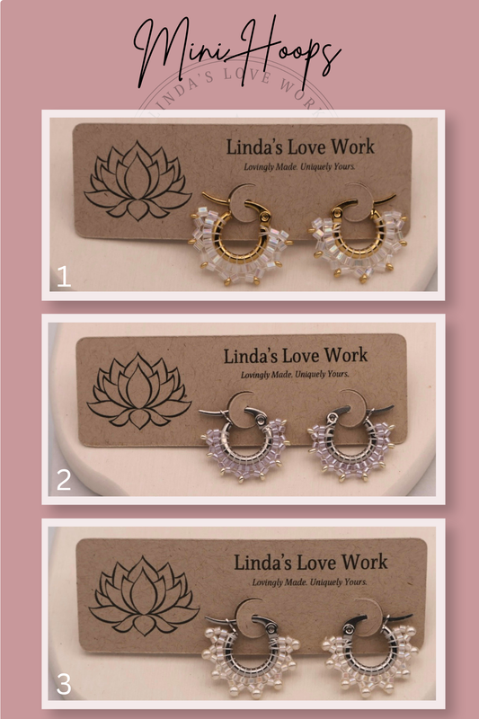 Three pairs of hoop earrings on display with 'Linda's Love Work' branding.