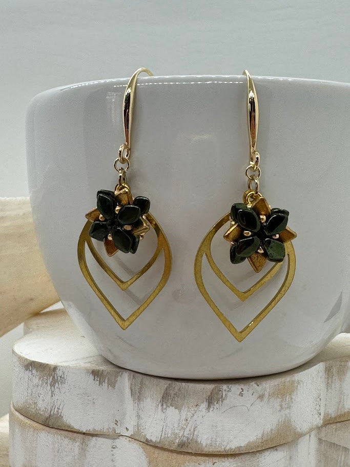 Succulent petal earrings laid flat on a beige or white surface, styled with dried flowers or greenery for a nature-inspired aesthetic.