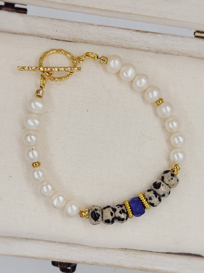 A bracelet with pearl, Dalmatian jasper, a lapis lazuli beads.