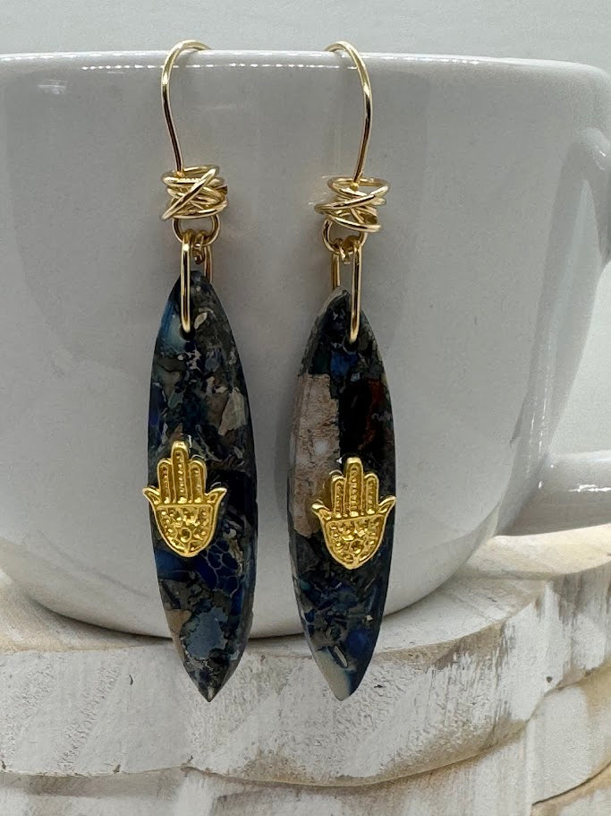 Gemstone Earrings worn in a soft, natural light setting, highlighting the way the gemstones catch the light and shine.