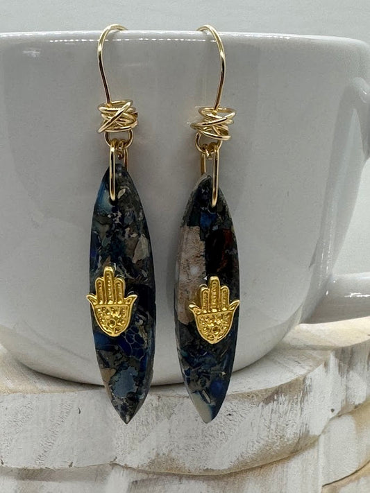 Gemstone Earrings worn in a soft, natural light setting, highlighting the way the gemstones catch the light and shine.