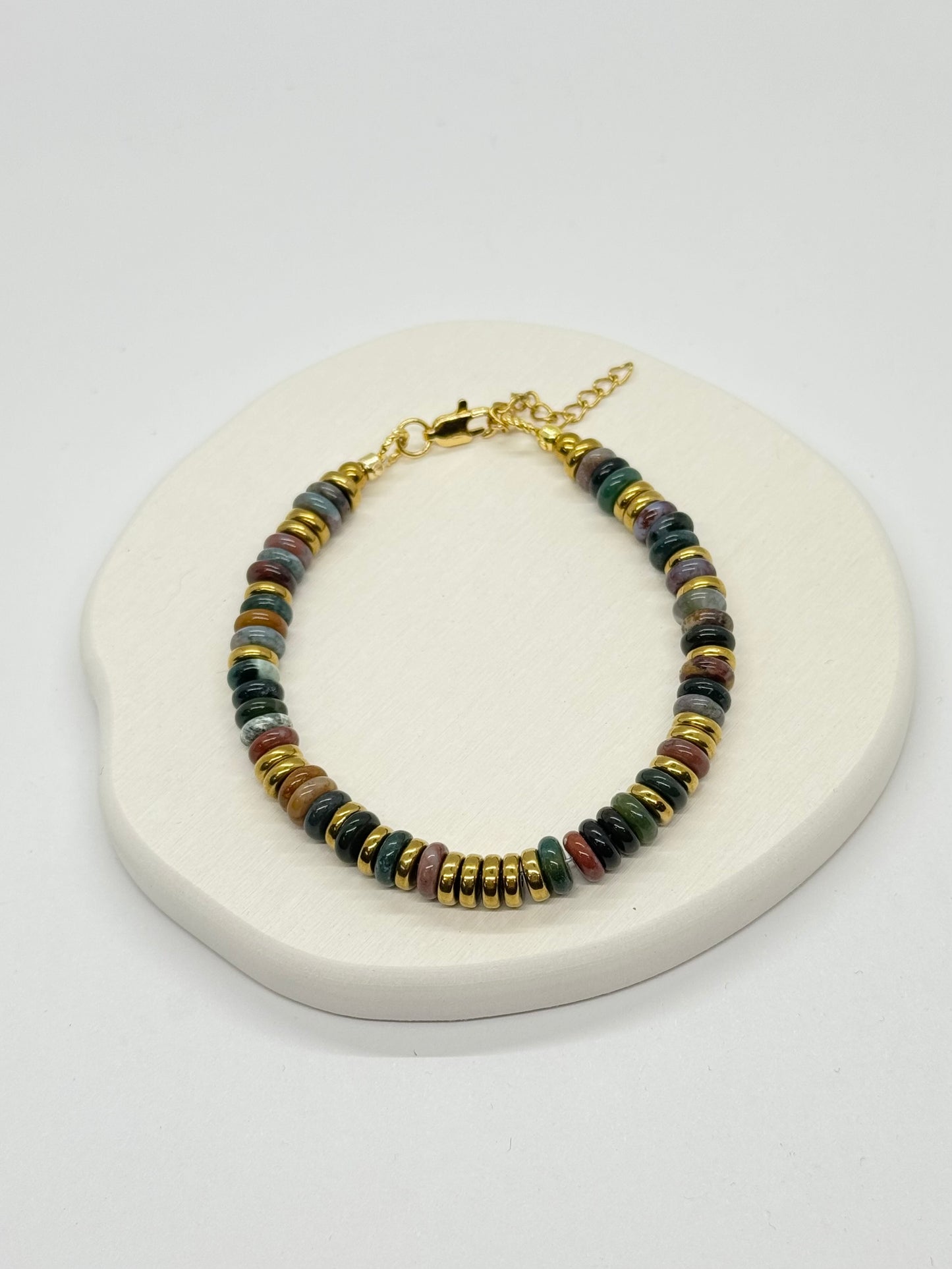 Multicolored beaded bracelet on a white surface