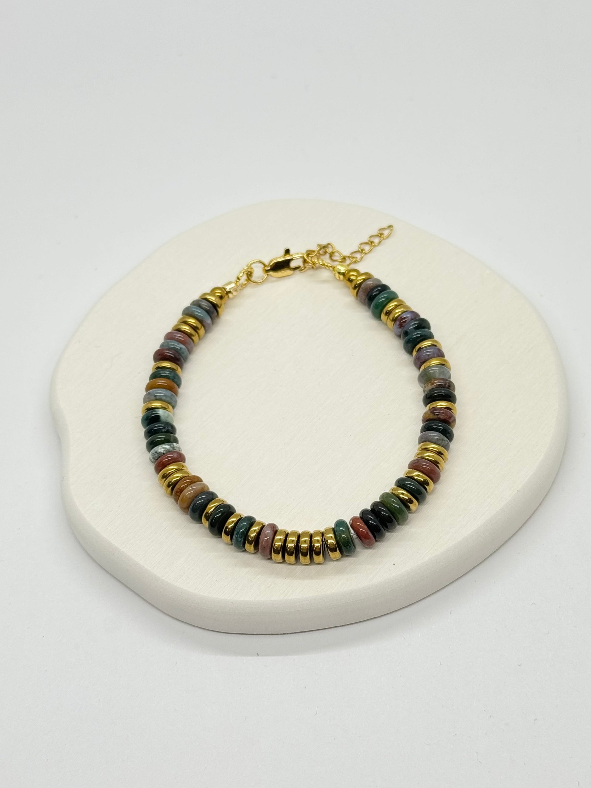 Multicolored beaded bracelet on a white surface