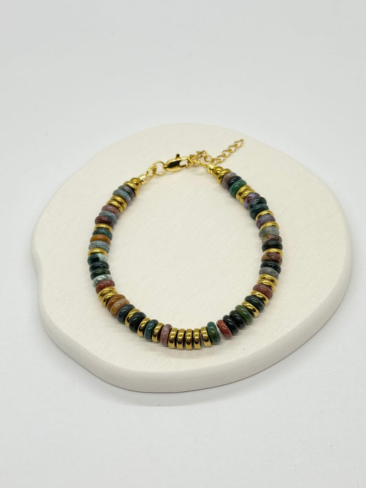Multicolored beaded bracelet on a white surface