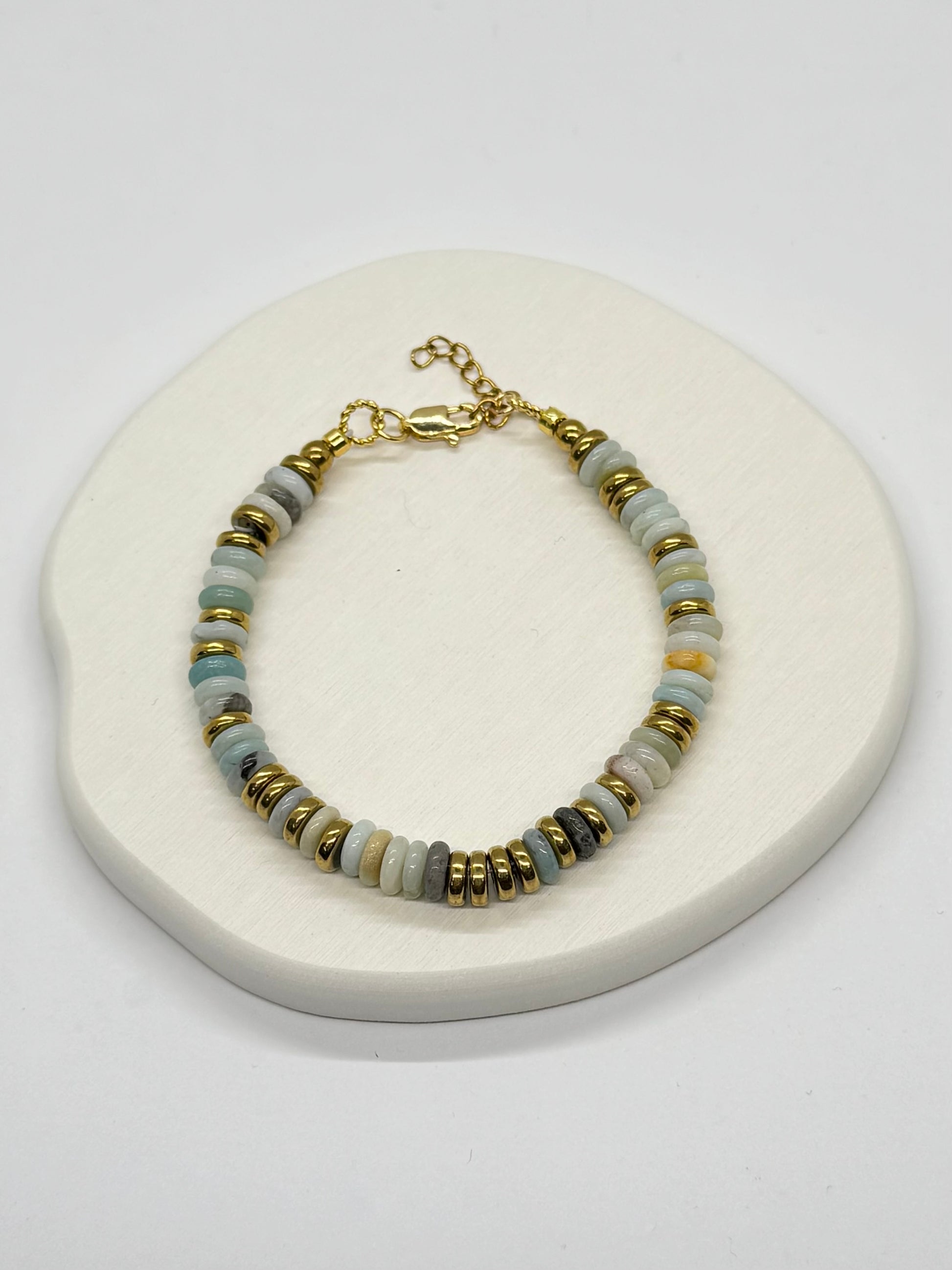 Bracelet with beaded design on a white surface