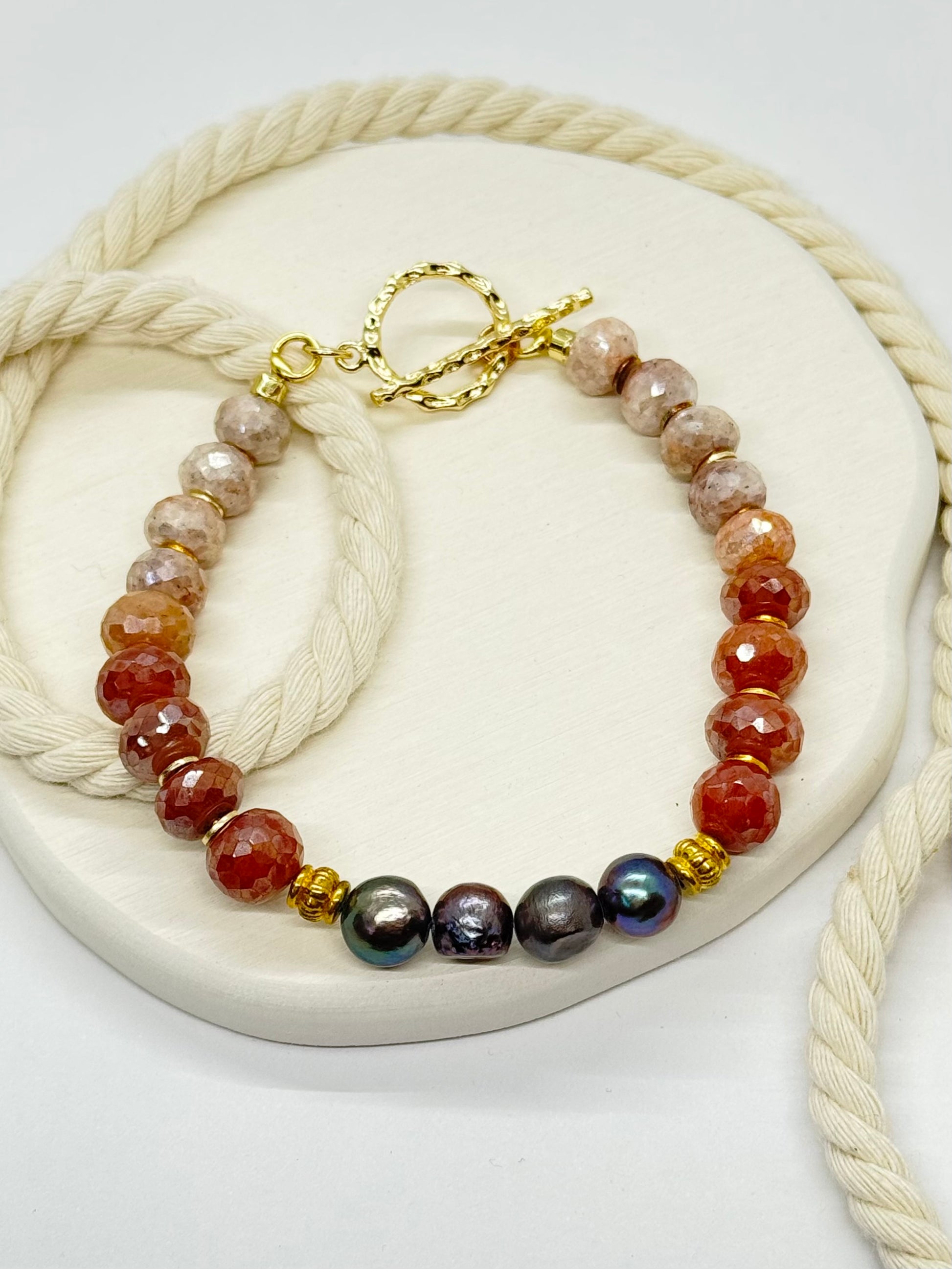 Bracelet with multicolored beads on a white surface