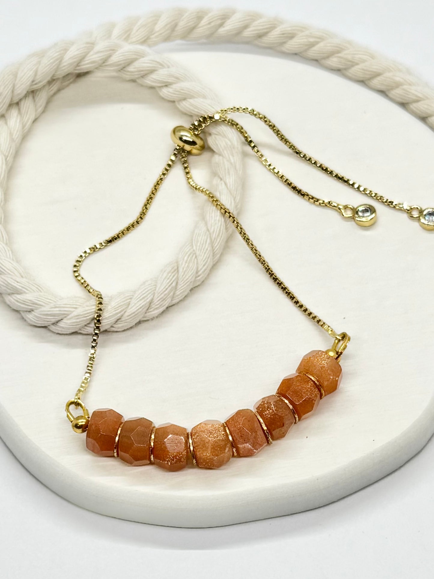 Necklace with brown beads on a white surface