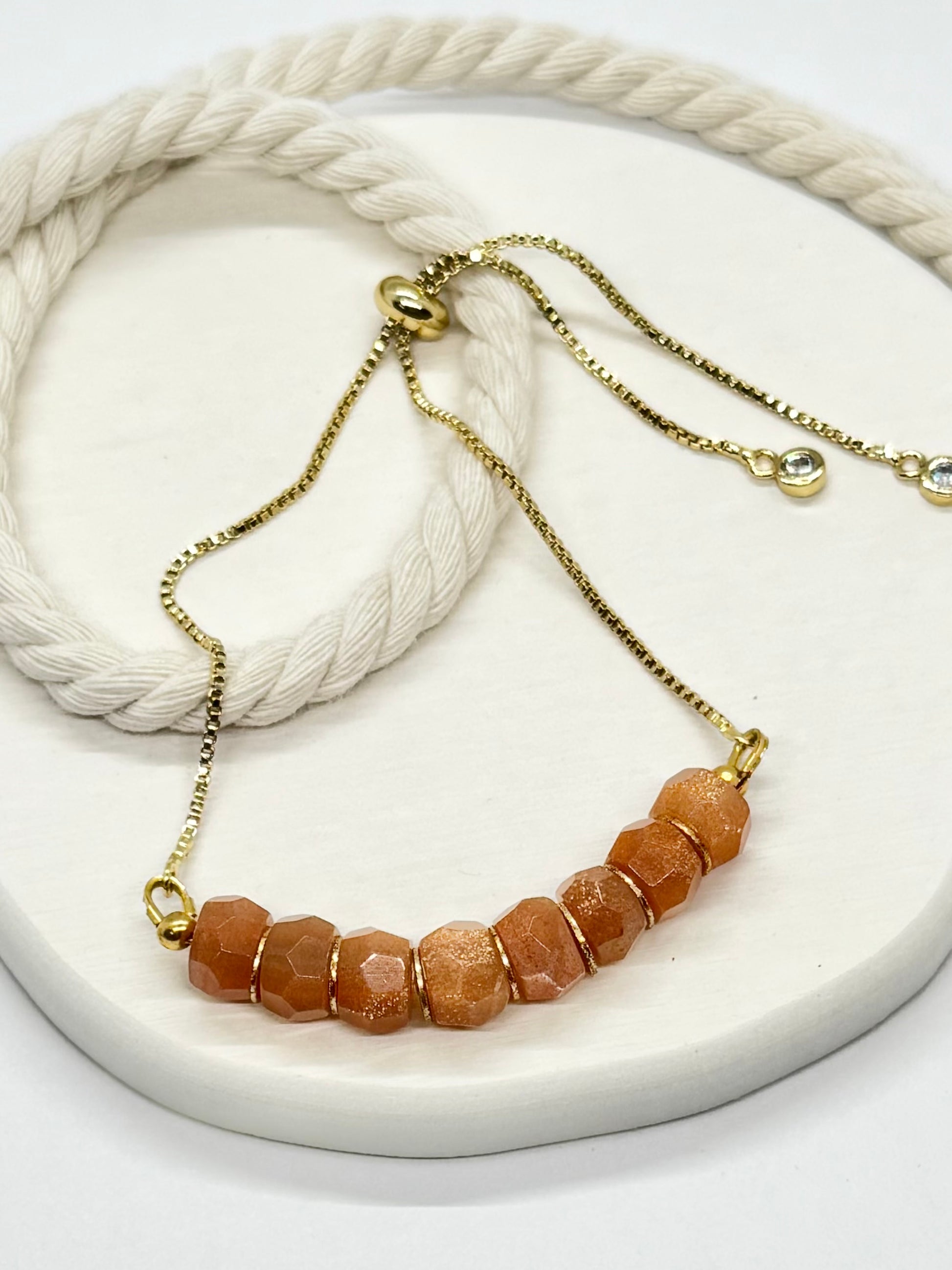 Necklace with brown beads on a white surface