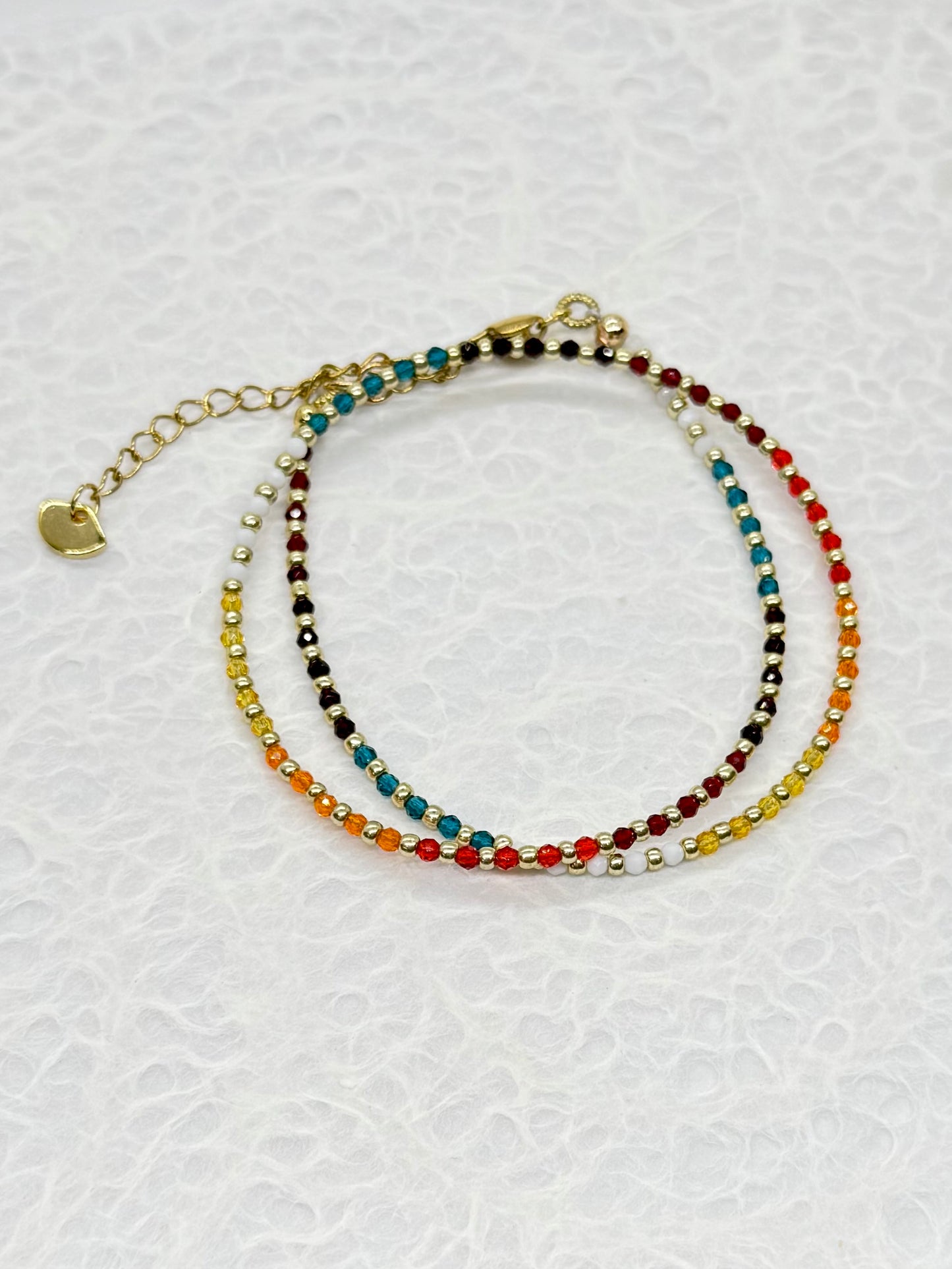 Multicolored beaded bracelet on a white background