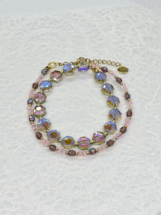 Multicolored beaded bracelet on a textured white background