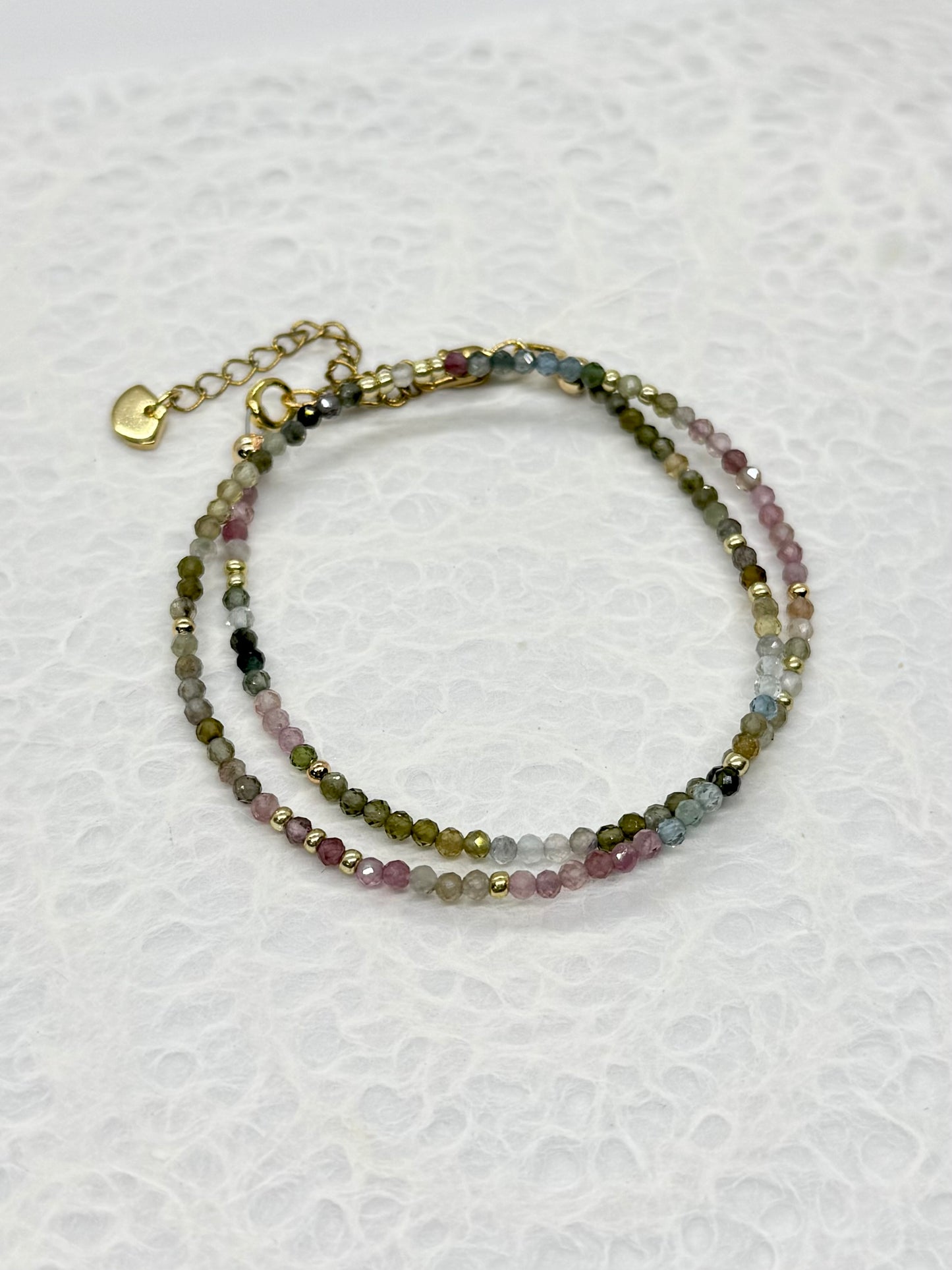 Multicolored beaded bracelet on a white background