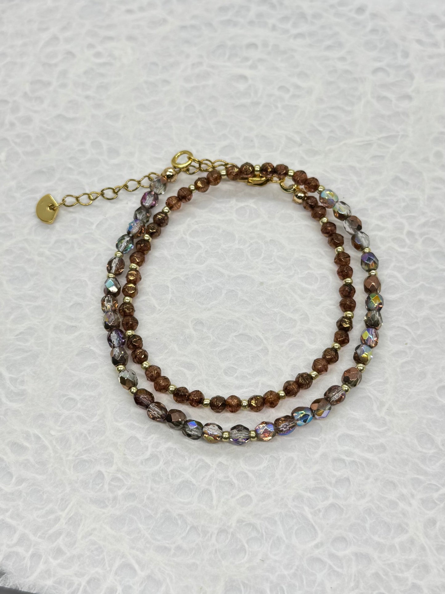 Multicolored beaded bracelet on a white background
