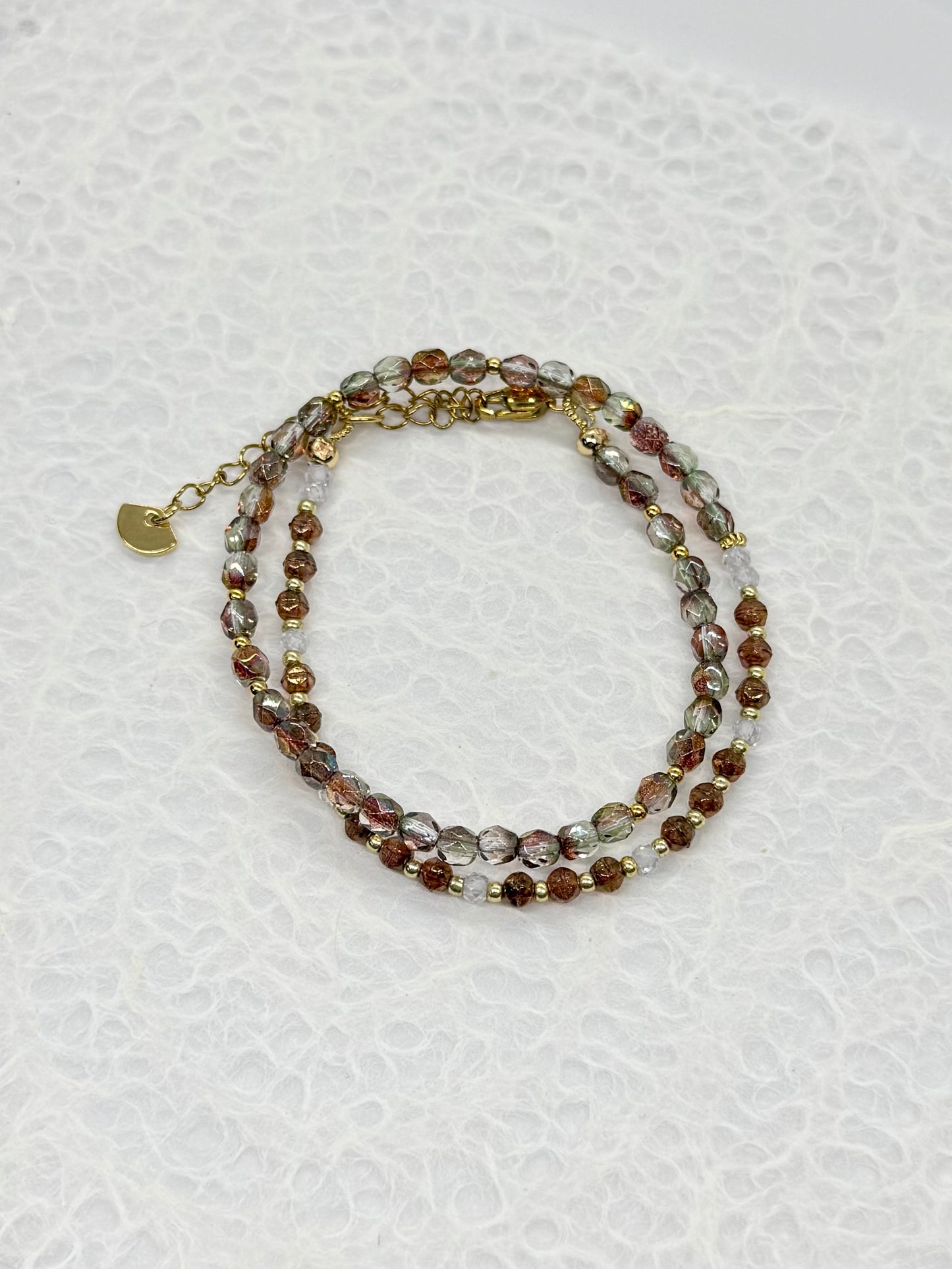Beaded bracelet on a textured white background
