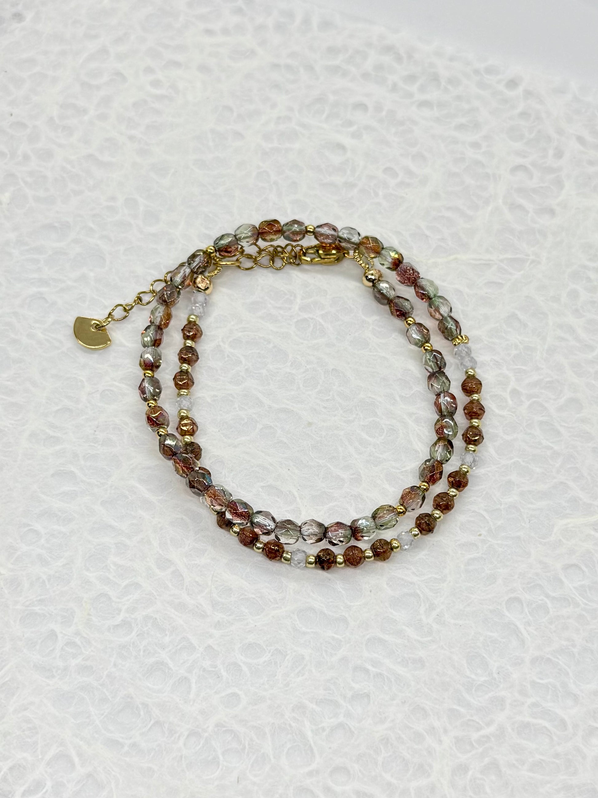 Beaded bracelet on a textured white background