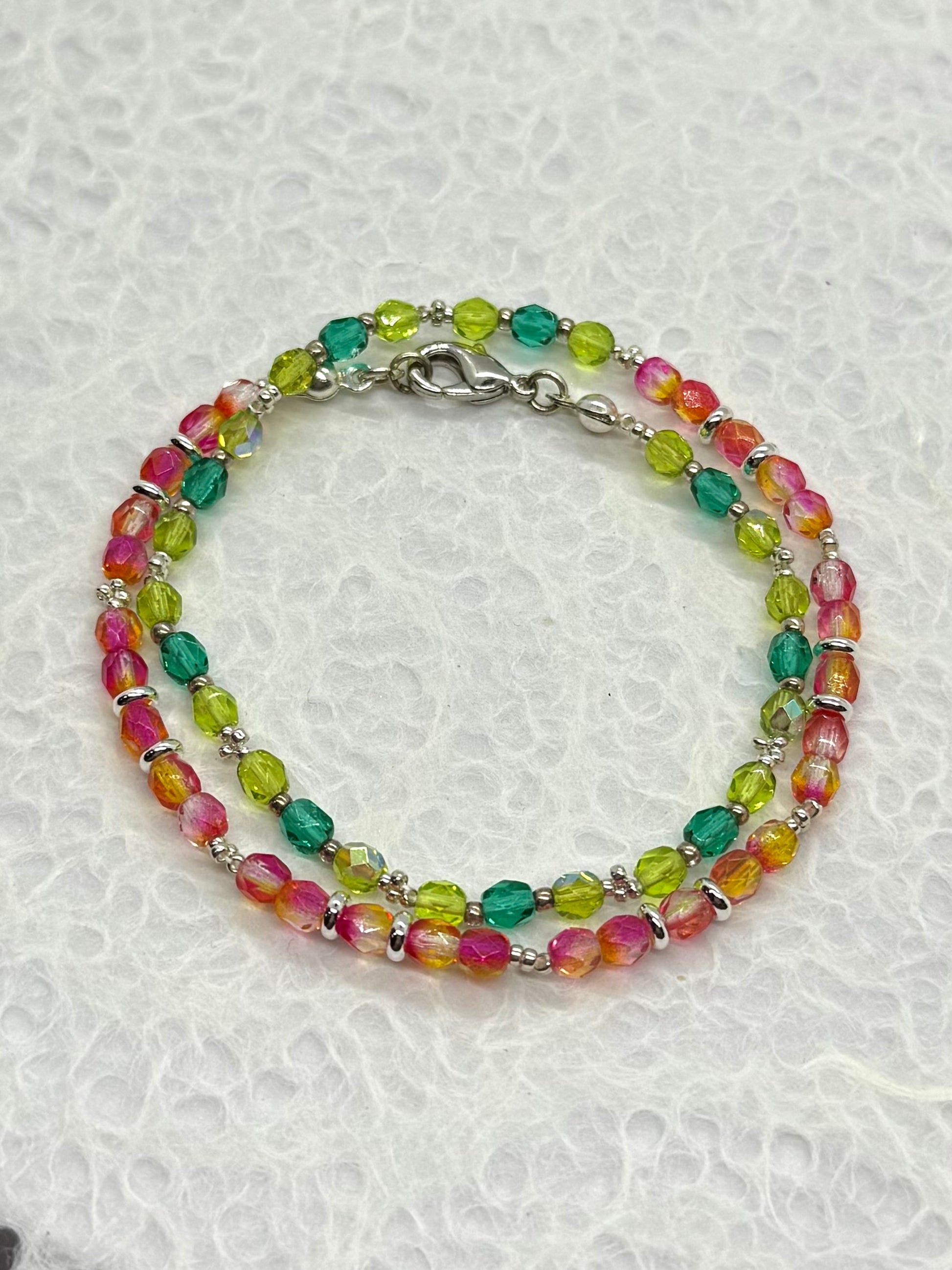 Multicolored beaded bracelet on a white background