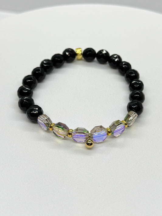 Black beaded bracelet with colorful beads on a white background