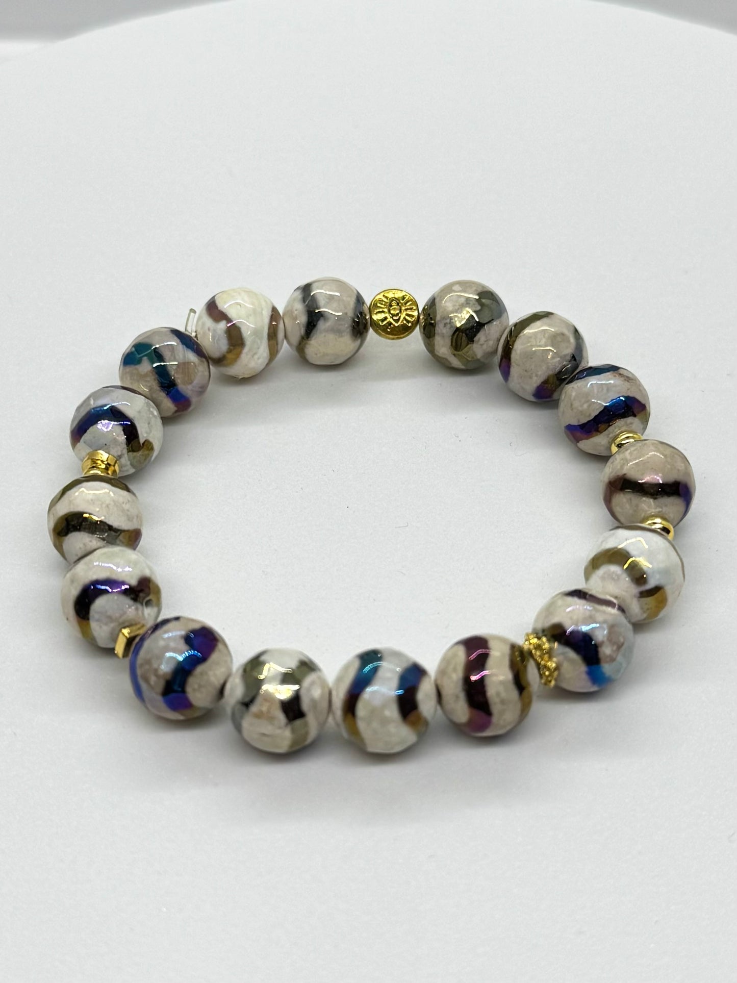 Beaded bracelet with decorative beads on a white background