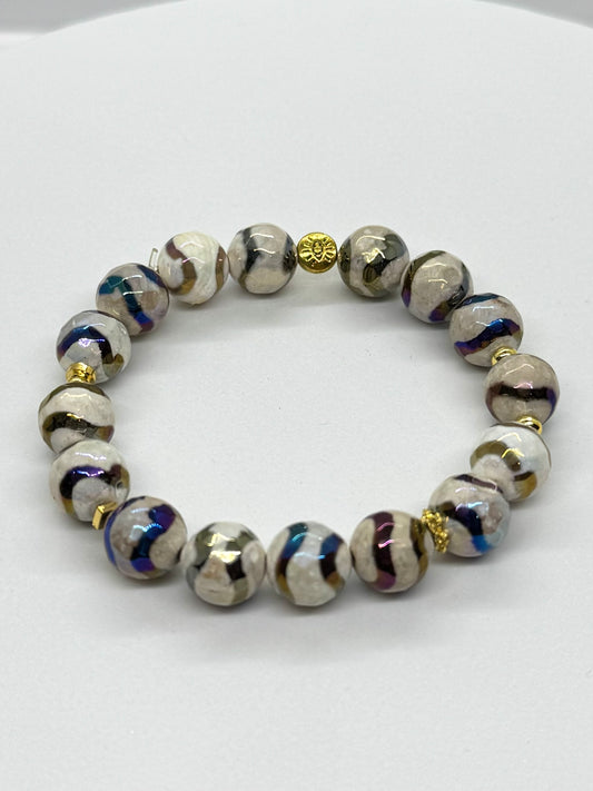 Beaded bracelet with decorative beads on a white background