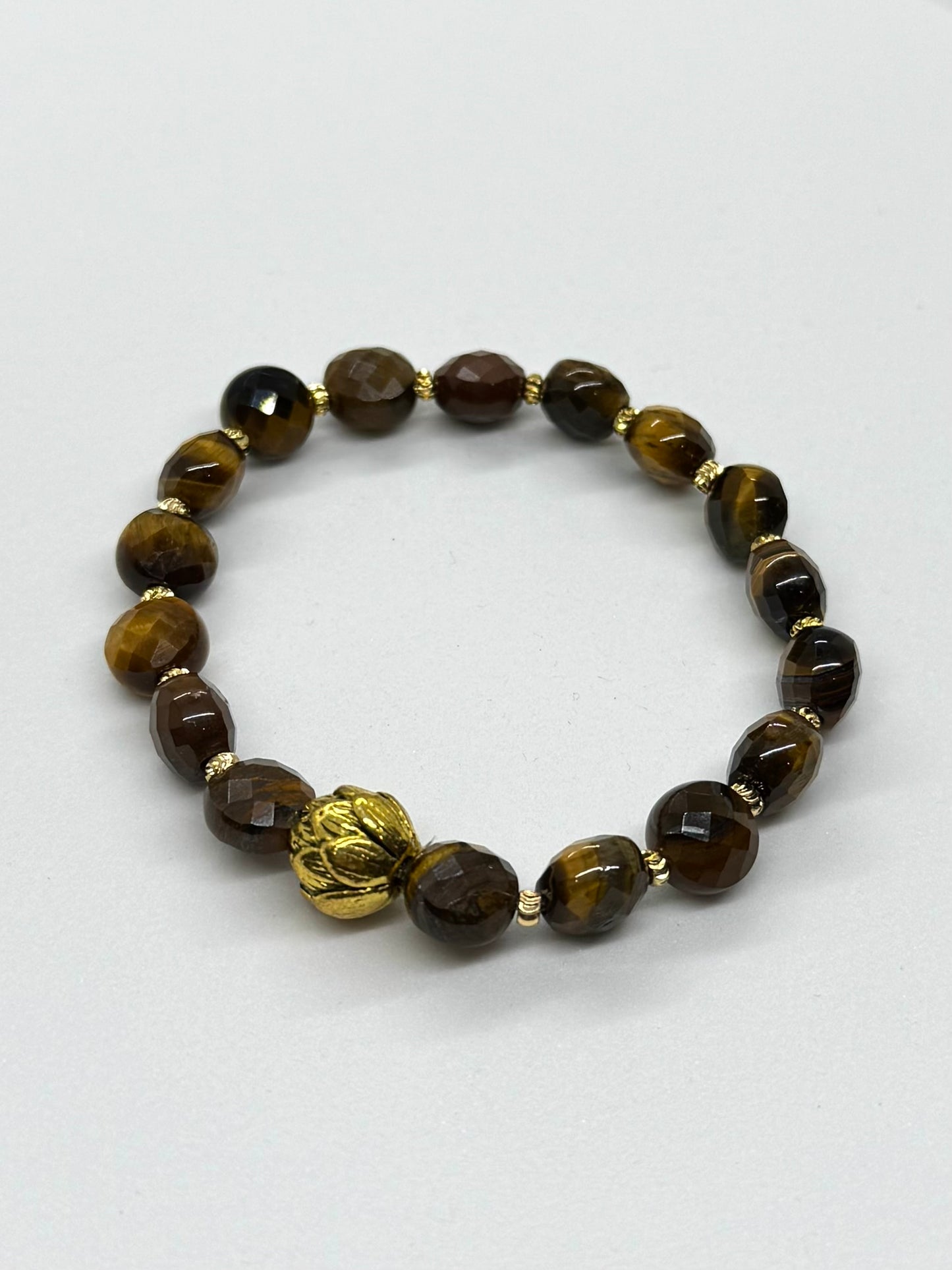Bracelet with brown beaded design on a white background