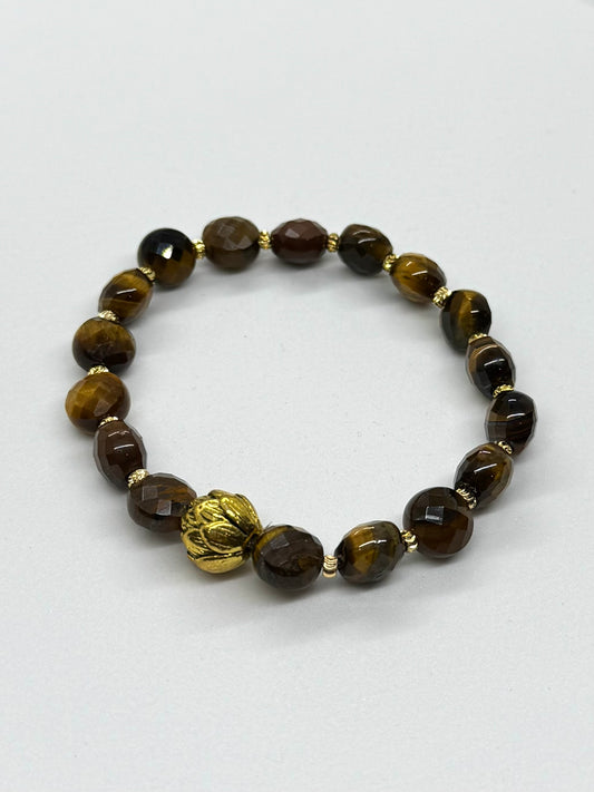 Bracelet with brown beaded design on a white background