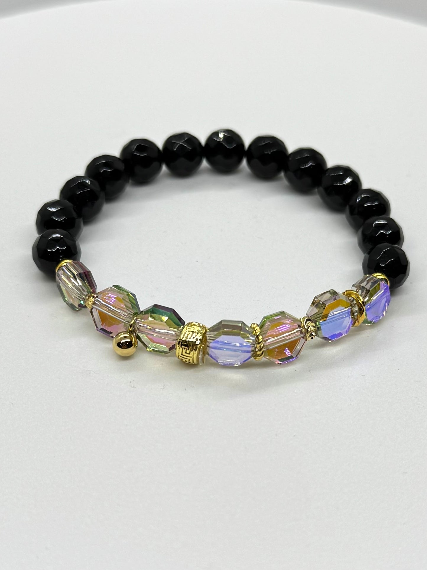 Black beaded bracelet with colorful beads on a white background