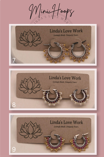 Three pairs of hoop earrings on display with 'Linda's Love Work' branding.
