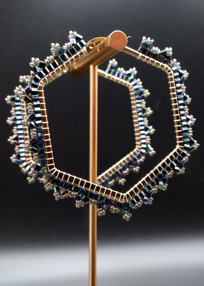 Decorative brooch with gemstones on a dark background