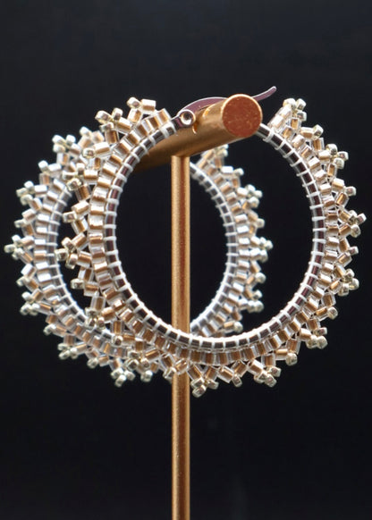 Decorative brooch with circular design on a black background