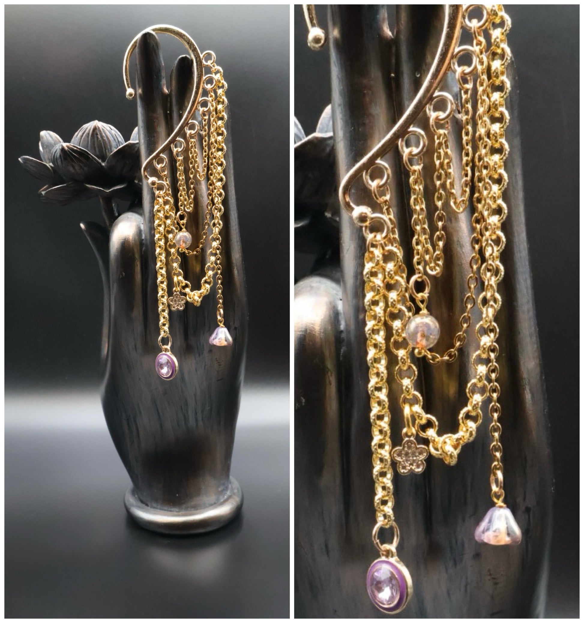 Gold chain earrings with pink gemstones on a black hand-shaped stand.