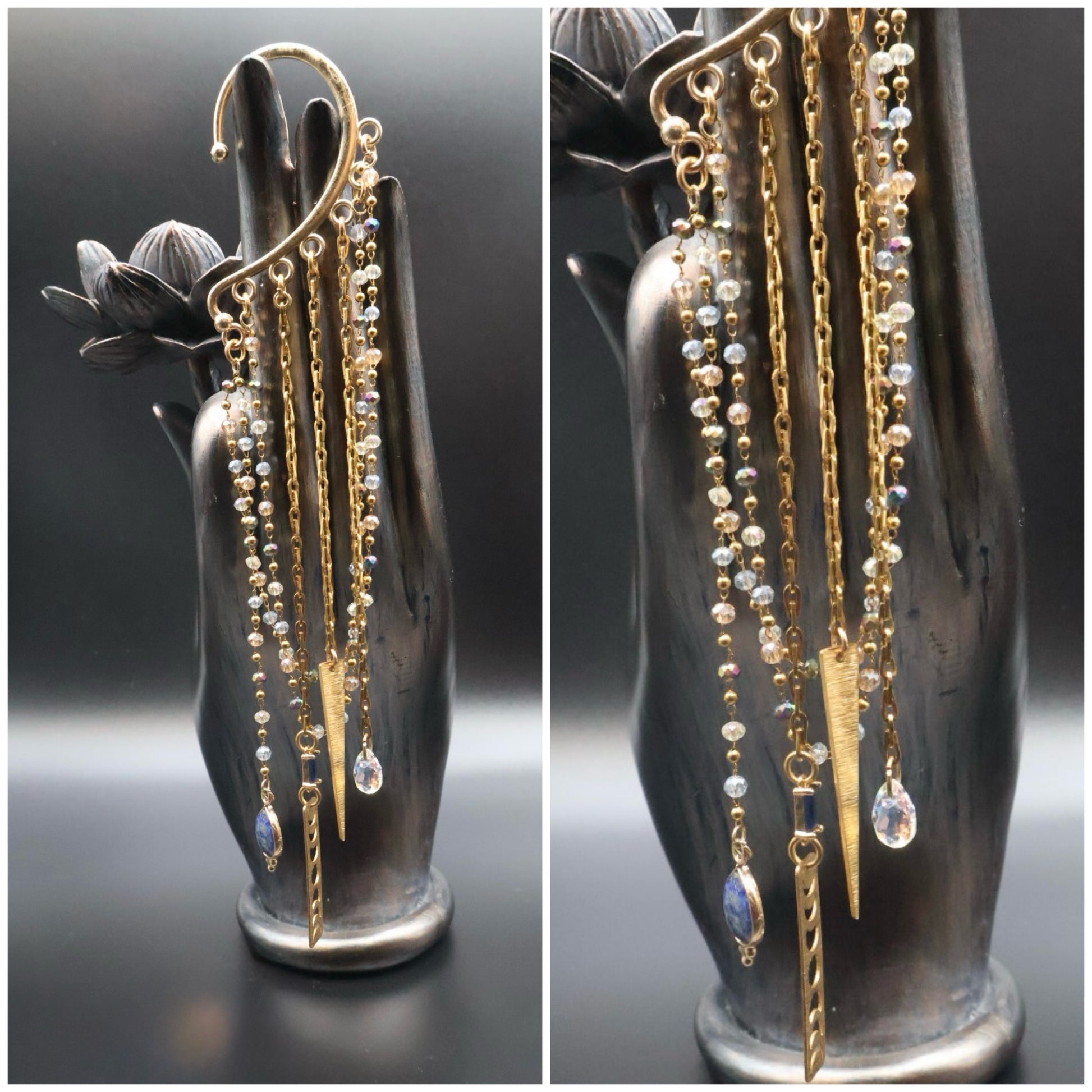 Pair of gold and beaded earrings on a black vase stand.