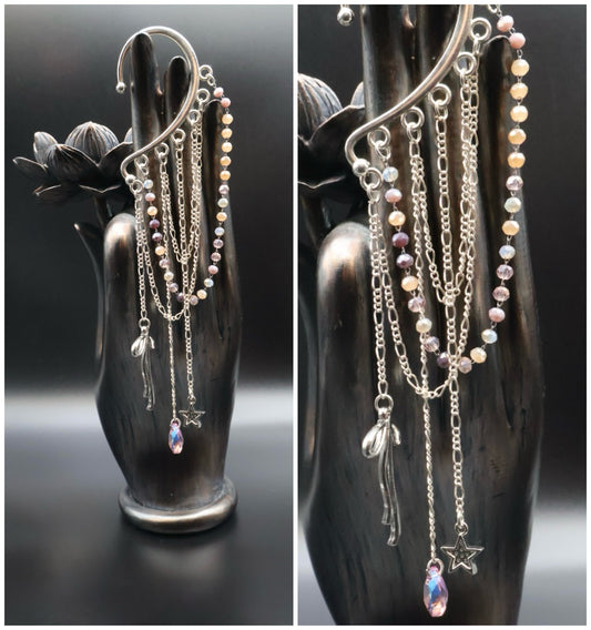 Collage of silver necklaces with star and heart pendants on a black hand-shaped stand.