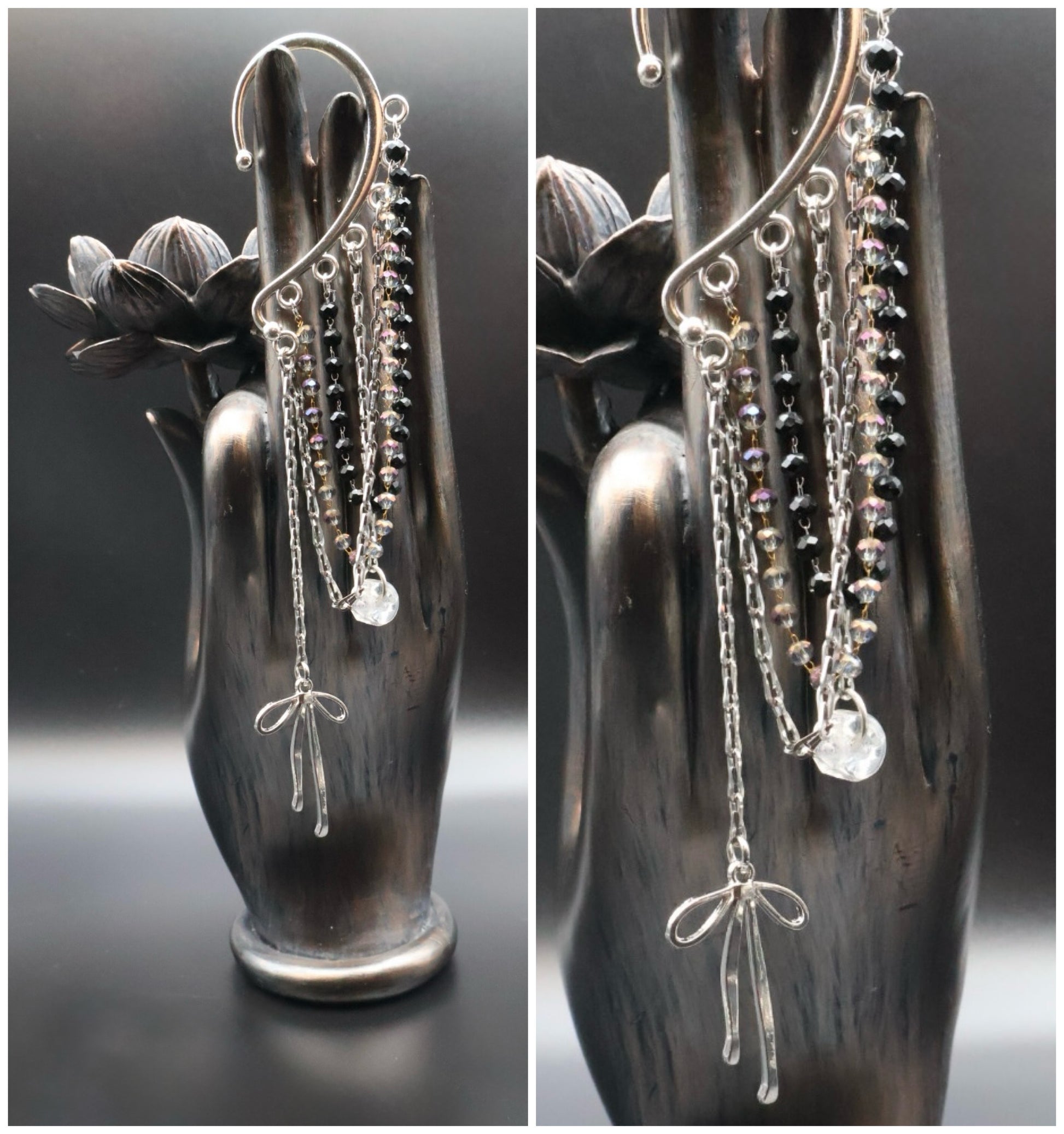 Silver chain earrings displayed on a decorative hand-shaped stand.