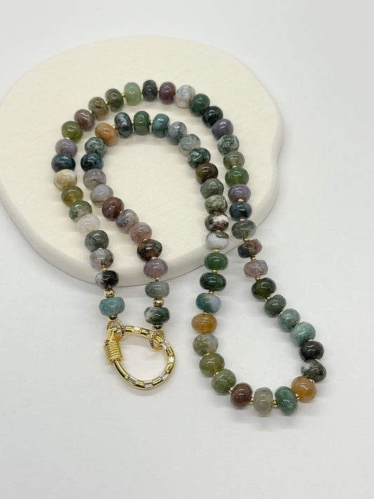 Beaded necklace with a gold clasp on a white background