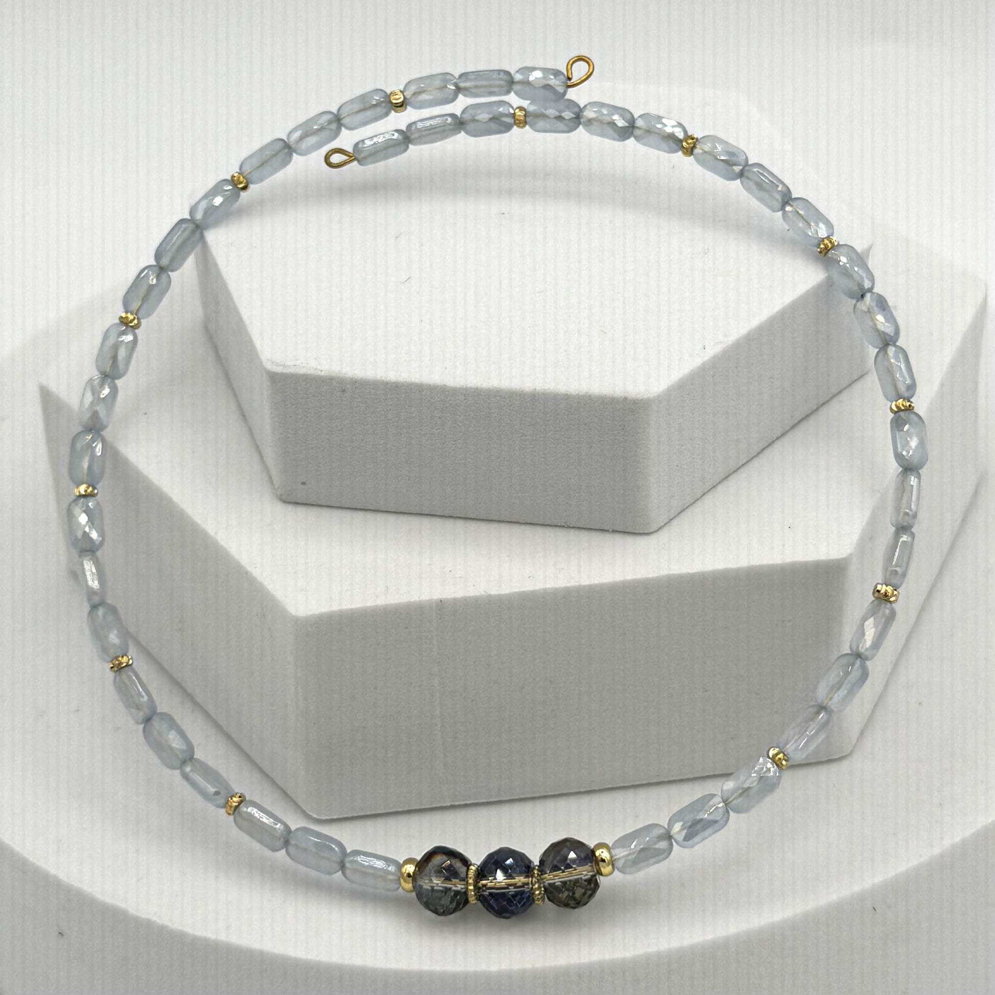 Necklace with gray and black beads on a white background