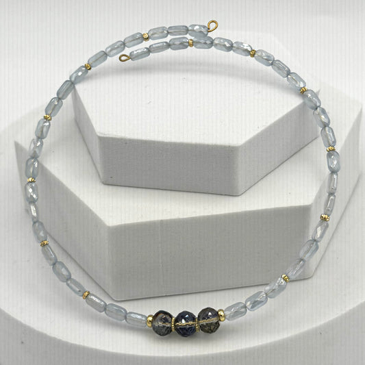 Necklace with gray and black beads on a white background