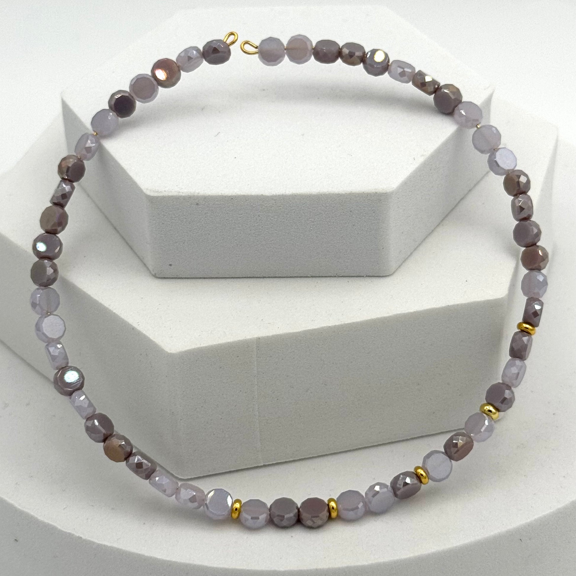 Necklace with gray beads on a white background