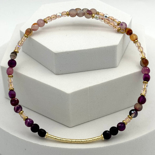 Necklace with multicolored beads on a white background