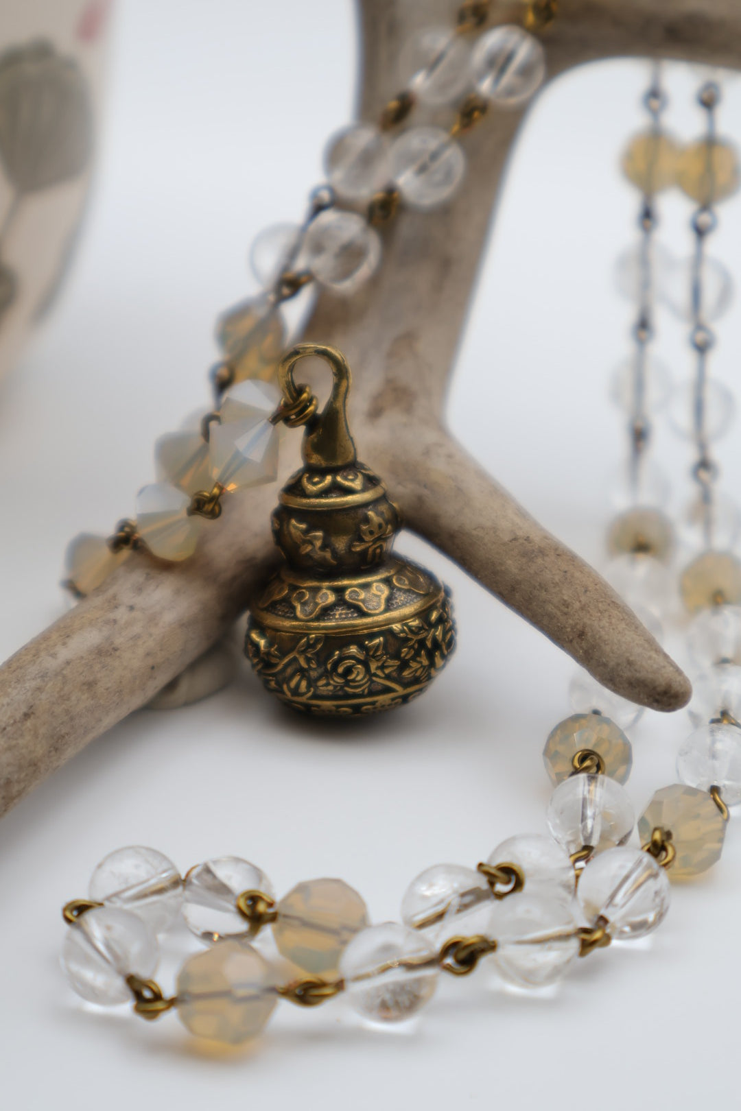 Necklace with clear beads and gold clasp on a starfish