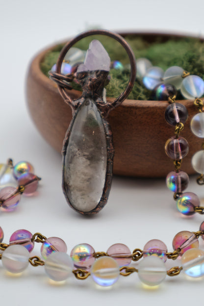 Close-up of a rosary with a focus on the central pendant.