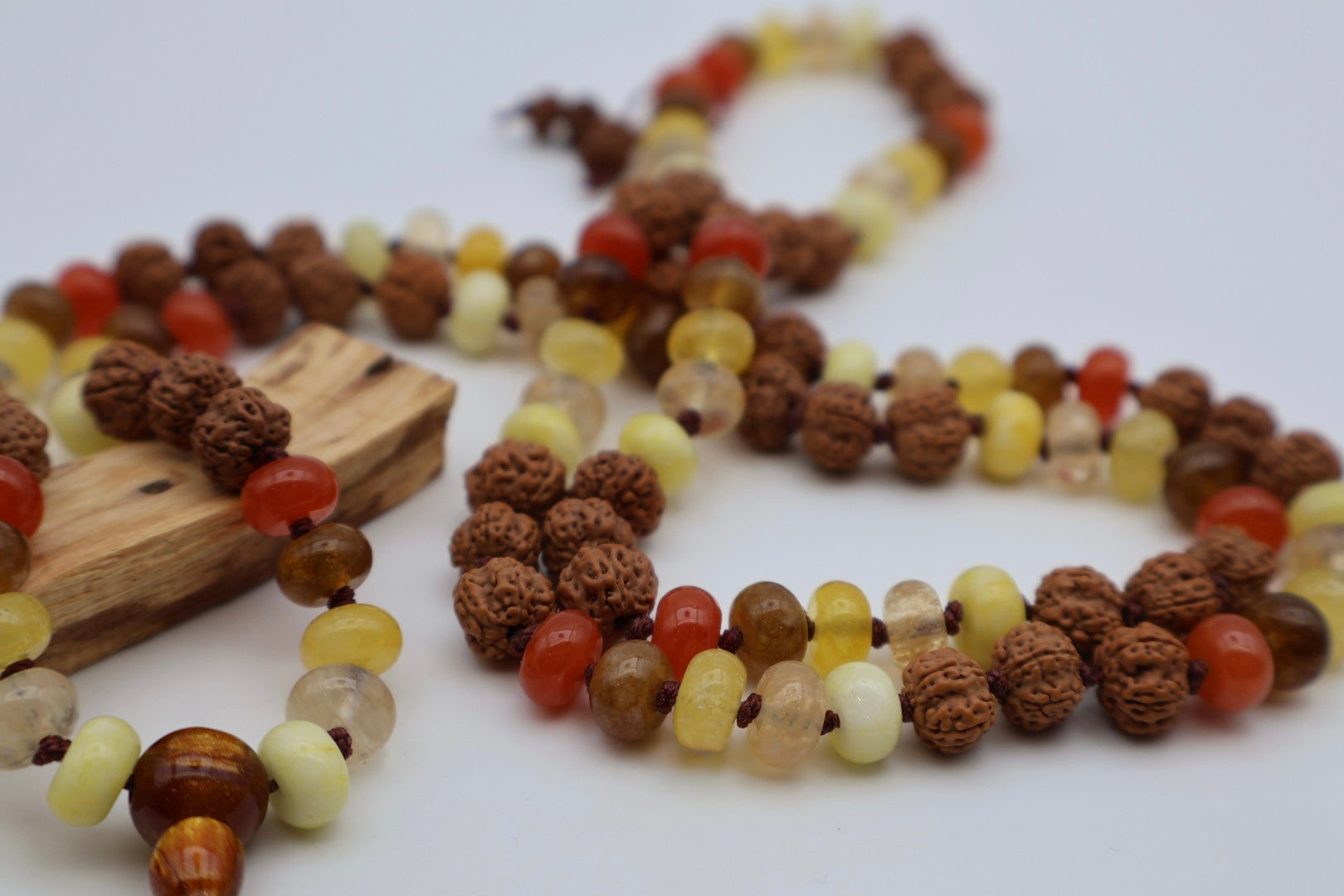 Necklace with multicolored beads on a white background