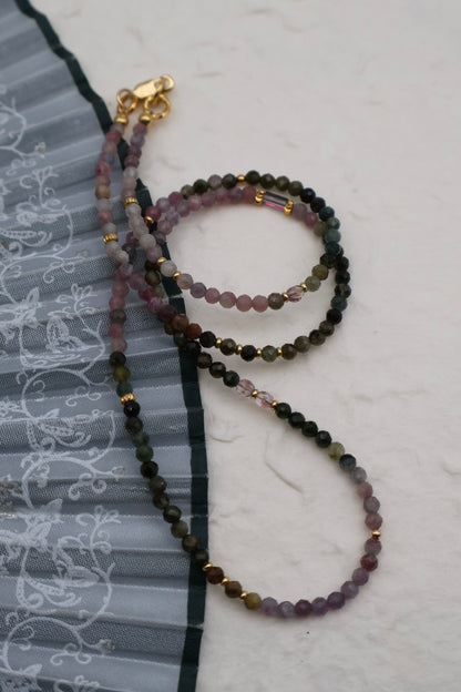 Set of beaded necklaces on a textured surface
