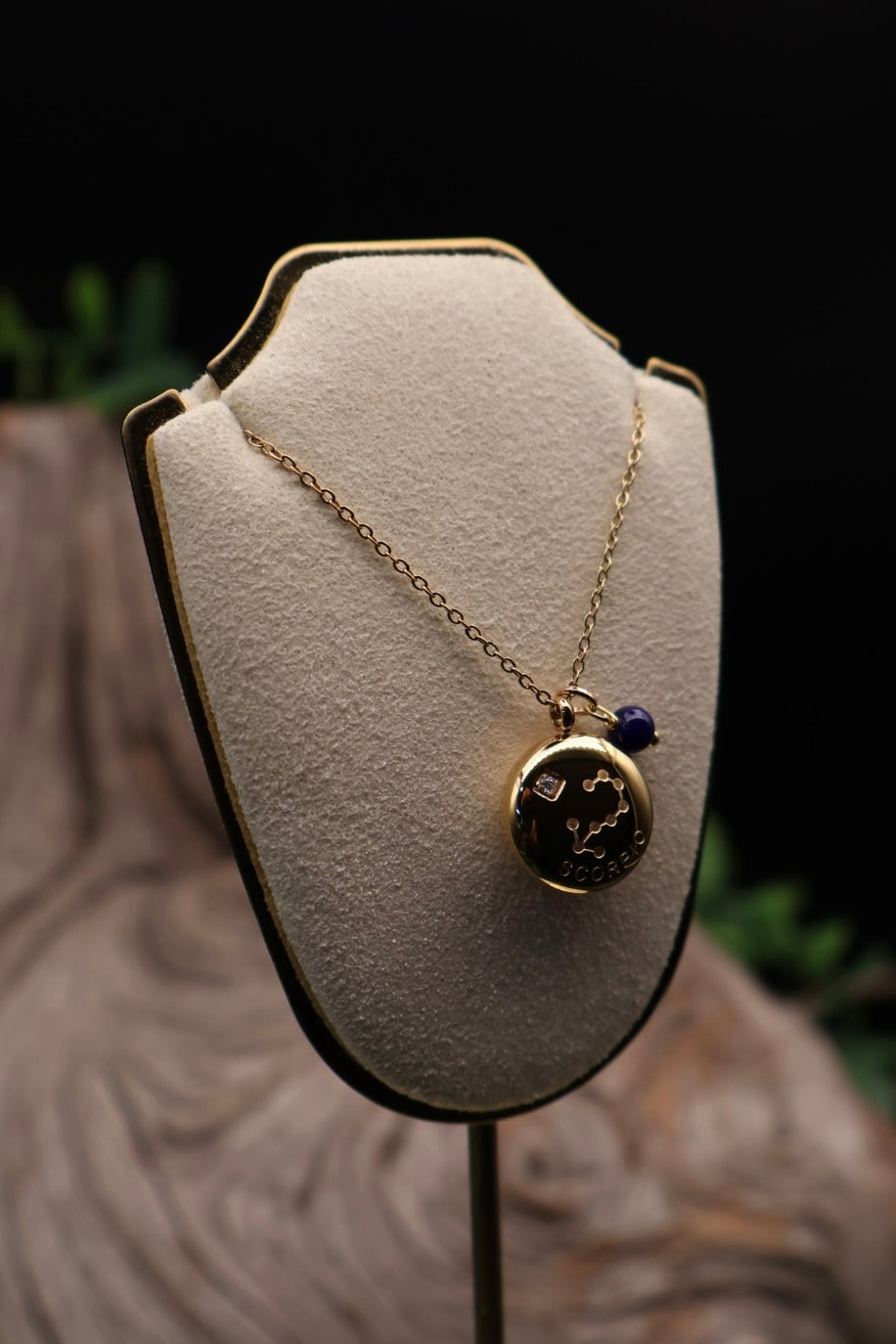 Necklace with a pendant on a beige jewelry display