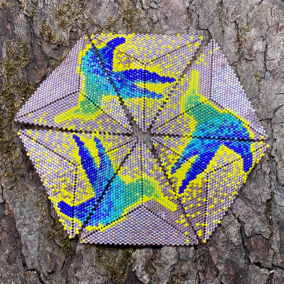 Geometric design with blue and green birds on a textured tree bark background