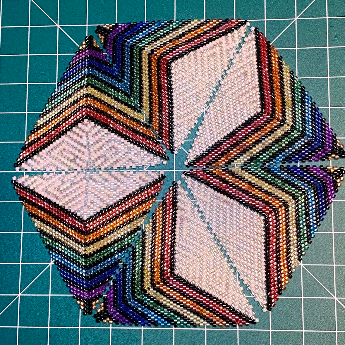 Geometric bead pattern on a grid background