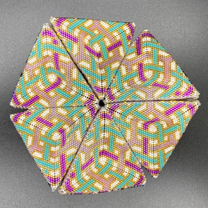 Decorative kaleidocycle with a geometric pattern on a gray background