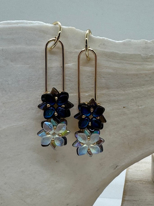 Several pairs of Succulent Stack Earrings displayed side by side, showing different variations in metal finishes or design details.
