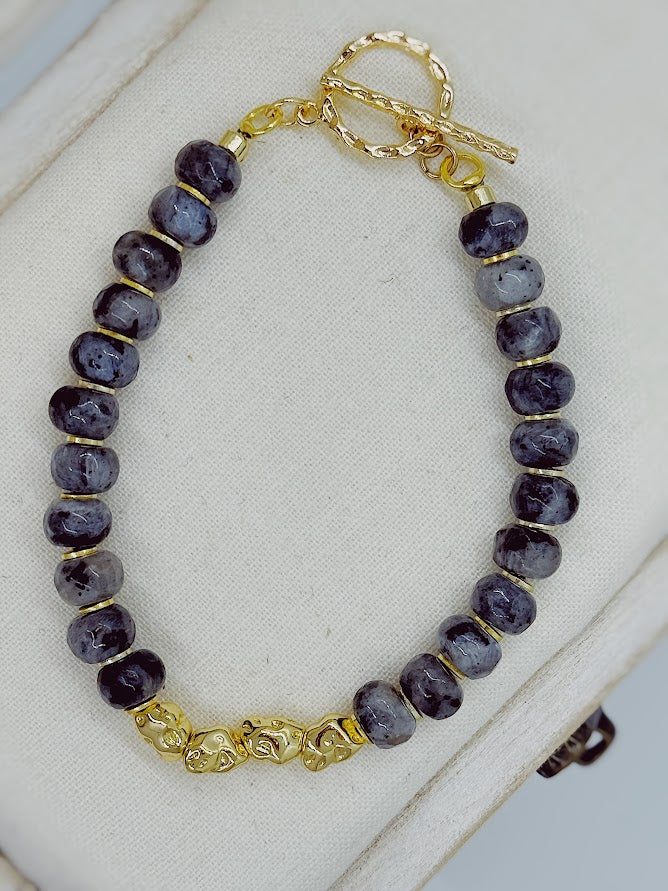 a larvikite bracelet with gold nugget beads