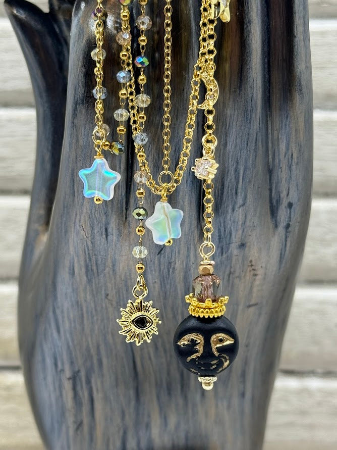 closeup of moon and star beads and gold cz charm