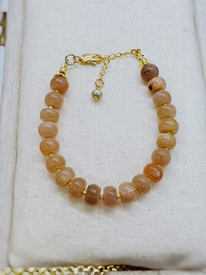 A bracelet made with sunstone beads